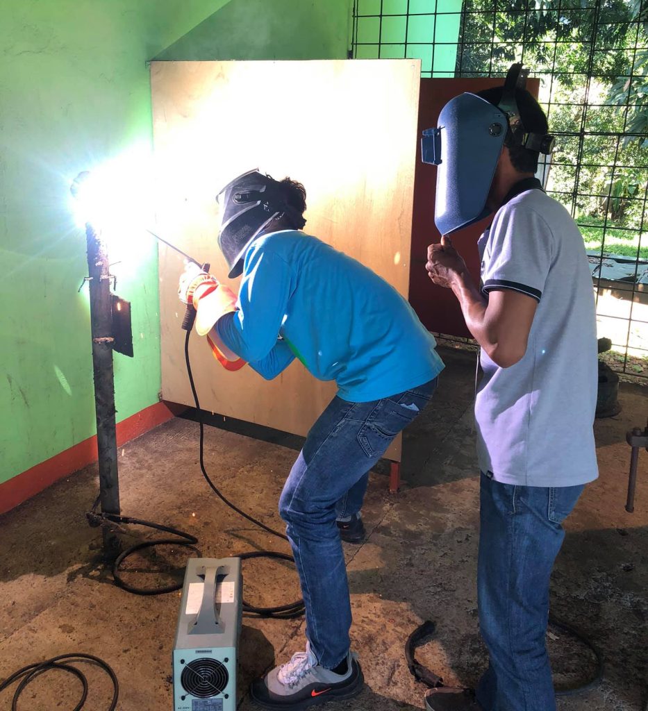 Students at Marcos Agro-Industrial School engaged in hands-on training for technical education