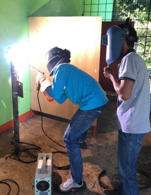 Students at Marcos Agro-Industrial School engaged in hands-on training for technical education